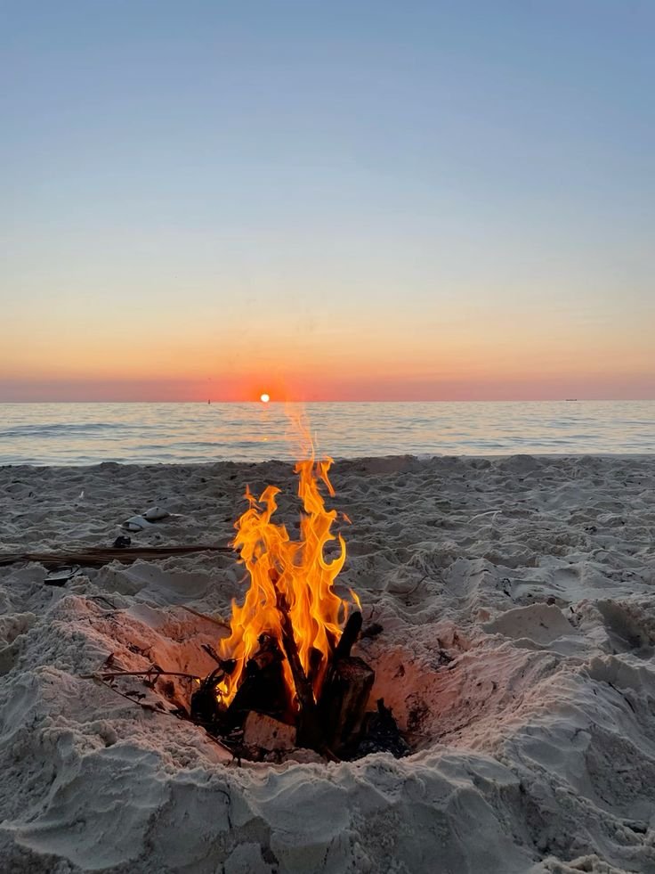 Bonfire on the beach at sunset