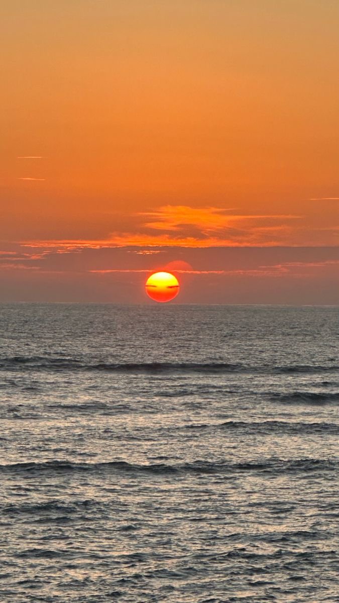 The sun setting over the Caribbean Sea